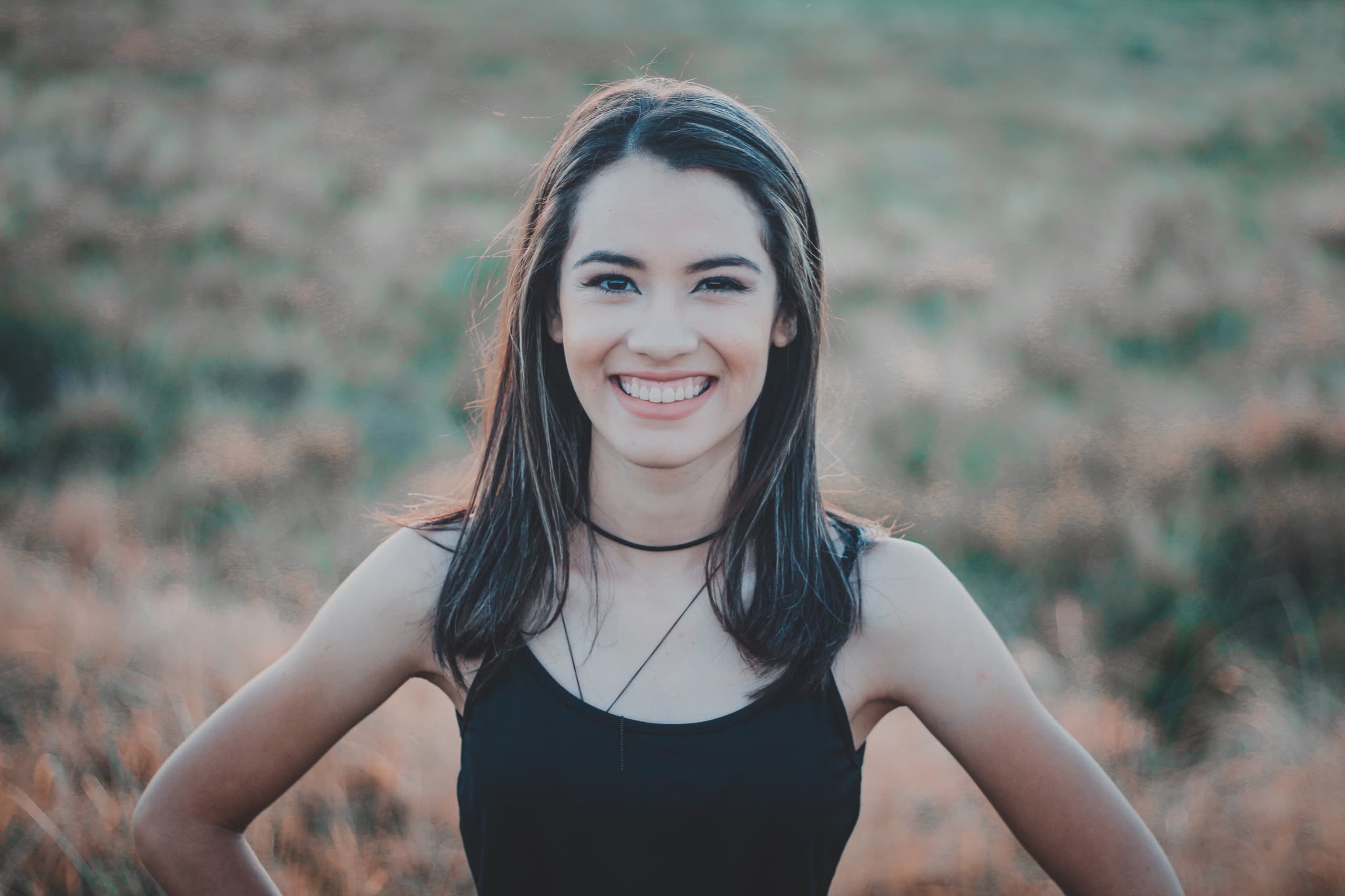 A woman with a bright, healthy smile